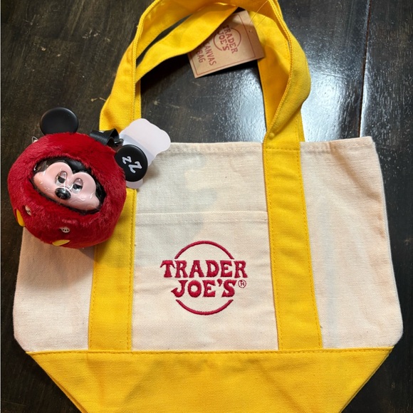 Disney Handbags - Trader Joe's Yellow and Cream Tote Bag with Miniso Mickey bag Charm